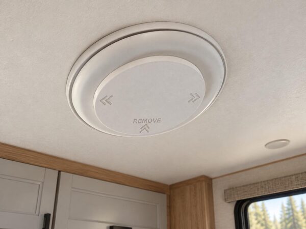 Illustrative RV interior mockup showing an AC vent cover. Not a photograph of a verified installation. Vent and RV not included.